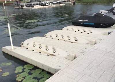 A boat dock with four boats on it.